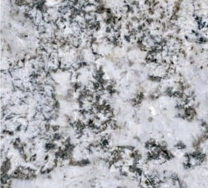 Alaska White swatch, white ground with grey and black clusters