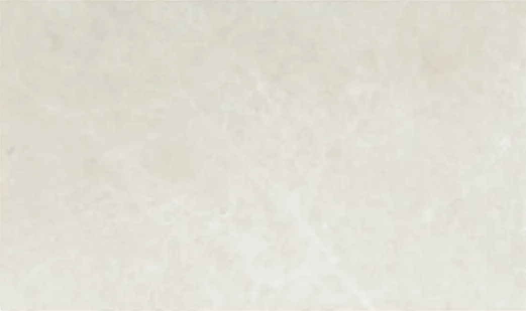 Bianco Marfil slab, off-white ground with a slight green-grey tone