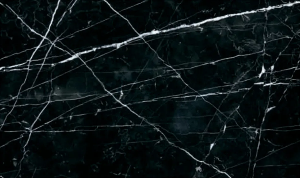 Nero Marquina slab, deep black ground with sharp white veins